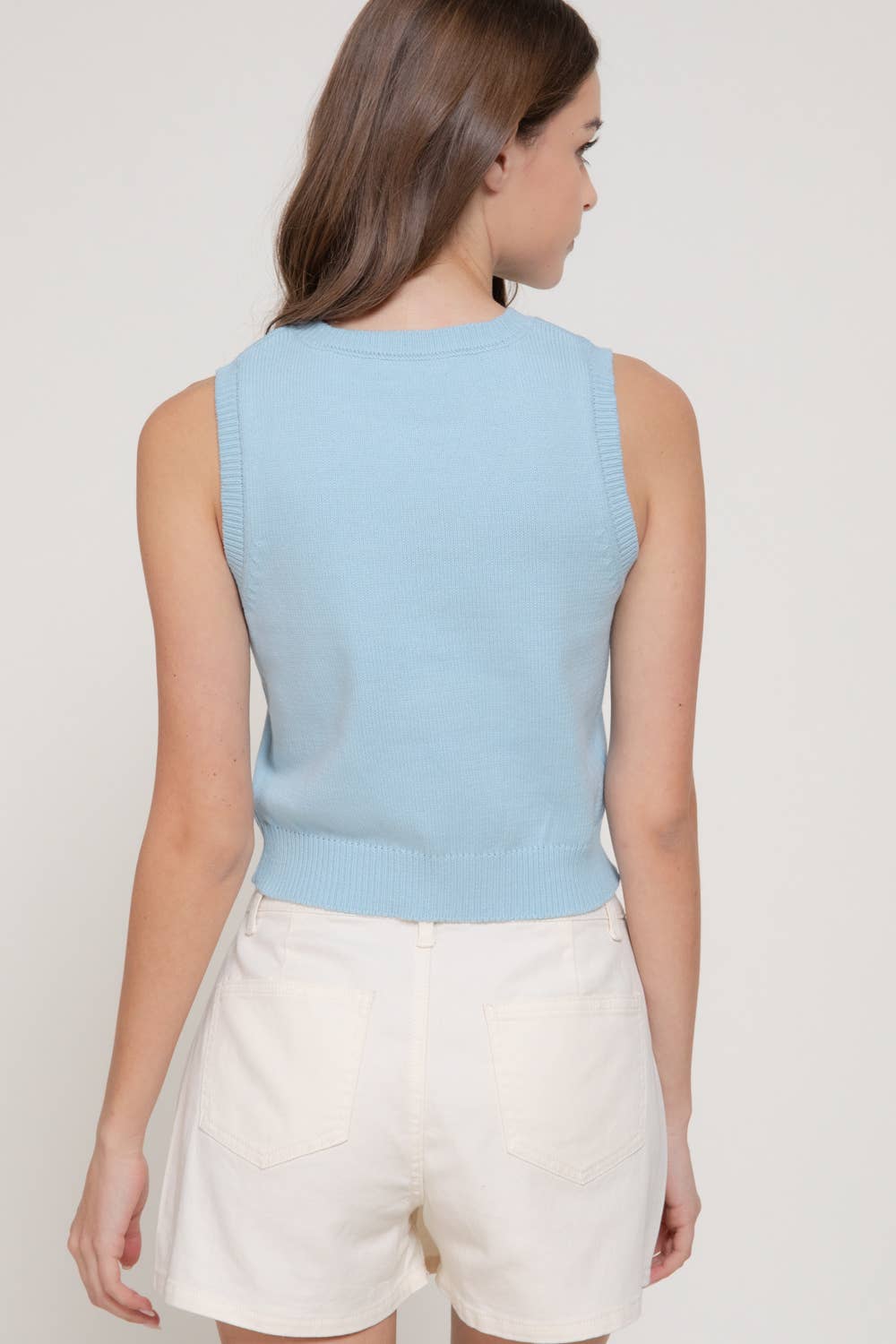 Top sin mangas de punto jacquard con cuello redondo